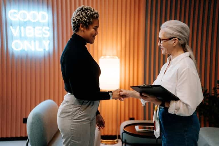 Woman shaking hands with a potential employer.