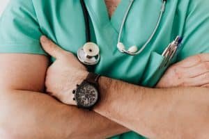 Close-up of a doctor with a stethoscope and crossed arms