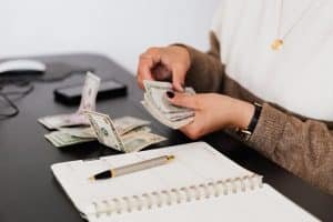 A woman counting money.