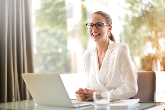 A woman sitting in her office