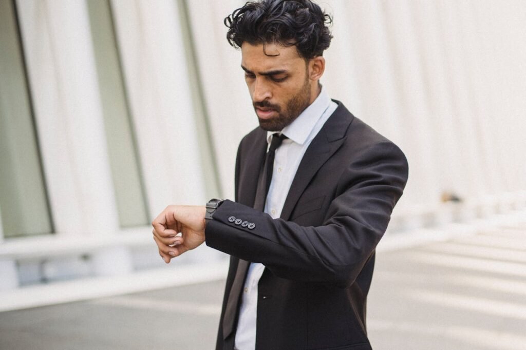Disgruntled businessman checking his watch